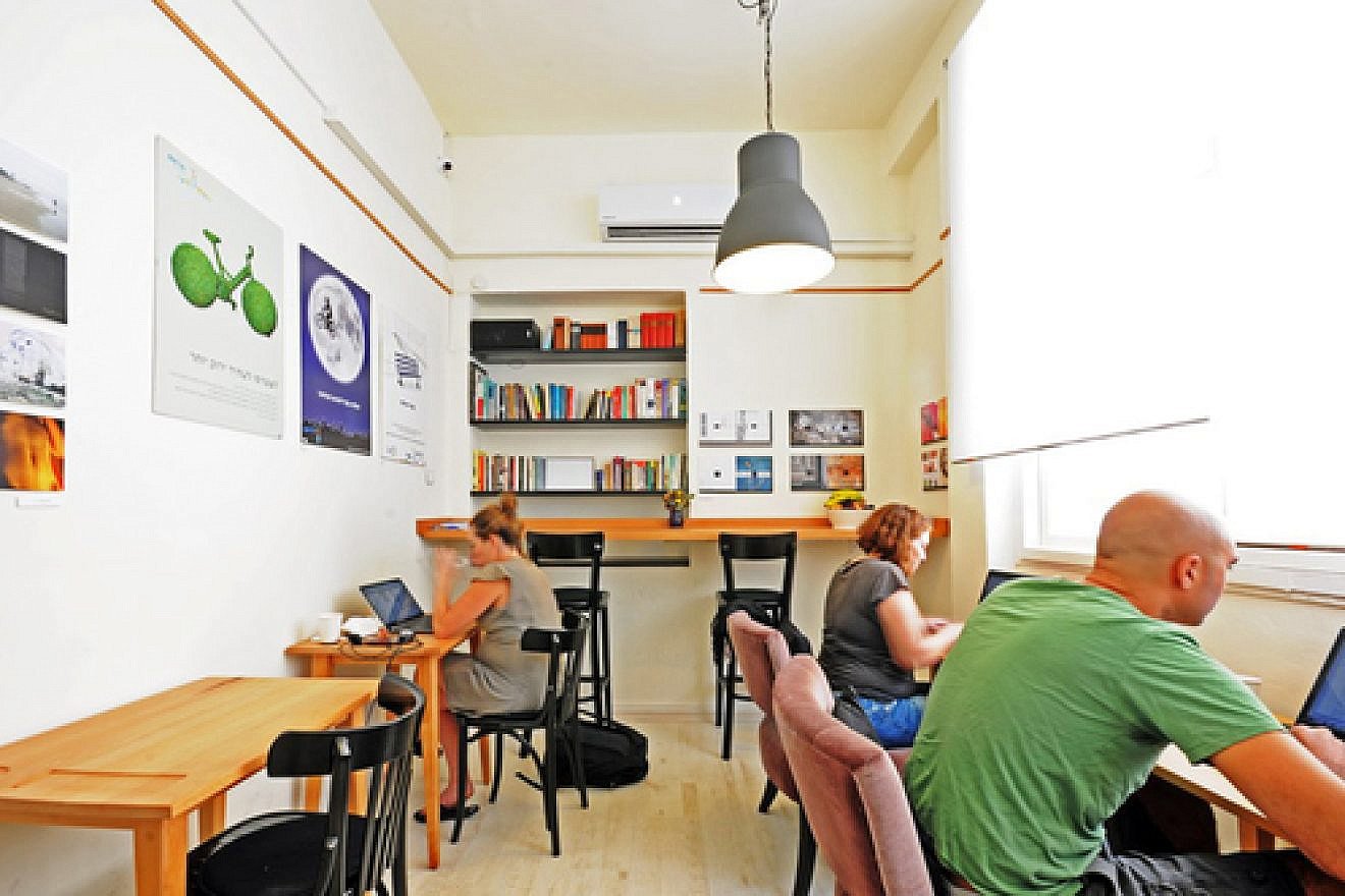 "Misanthrope," a shared workspace in Tel Aviv that is a haven for Israeli writers. In return for a small hourly fee, Misanthrope customers enjoy unlimited free coffee, fresh fruit, WiFi, and a comfortable public quiet space to work on personal projects. Credit: Courtesy.