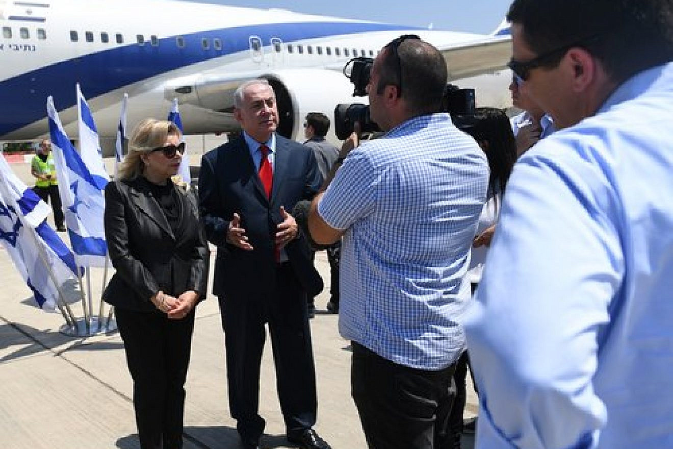 Israeli Prime Minister Benjamin Netanyahu, alongside his wife Sara, gives remarks before boarding a plane June 30, 2017. Credit: Kobi Gideon/GPO