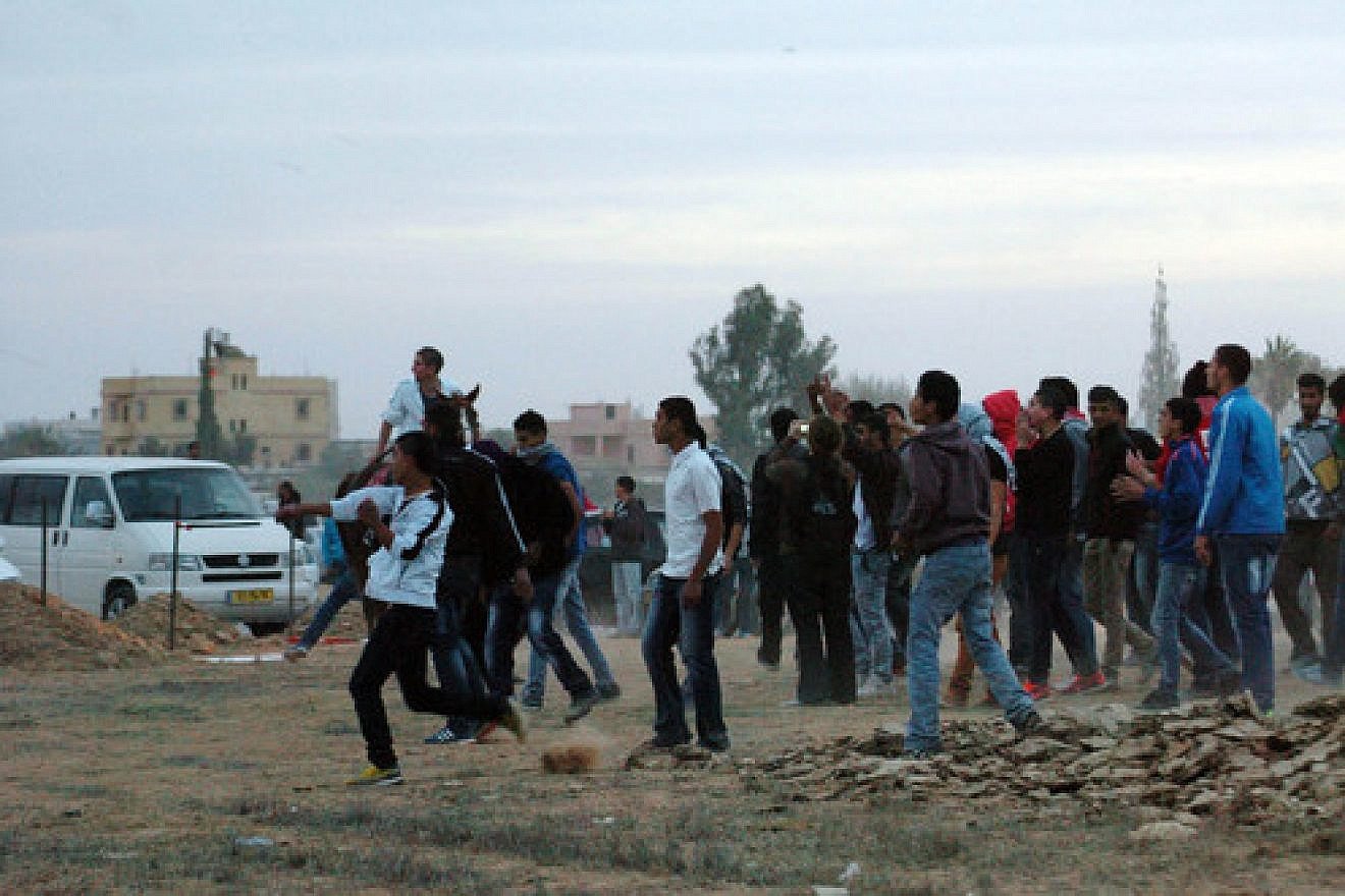 Click photo to download. Caption: On Nov. 30, 2013 in the southern Israeli town of Hura, demonstrators protest the Israeli government's "Prawer Plan" to resettle Bedouin residents of the Negev desert. The fate of the plan, which continued to be discussed by Israeli Knesset members after its apparent cancelation Dec. 12, remains a mystery. Credit: Flash90.
