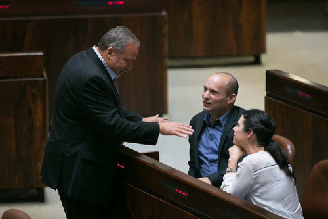 Israeli Defense Minister Avigdor Lieberman (left) with Israeli Education Minister Naftali Bennett discussing the acceptance of Palestinian refugees in a possible future Palestinian state. Photo by Miriam Alster/Flash90.
