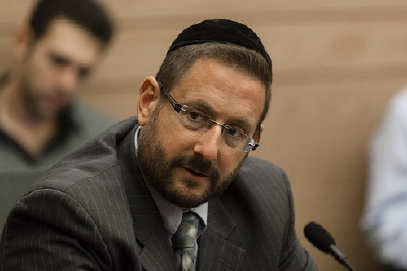 Member of Knesset Rabbi Dov Lipman (Yesh Atid) is pictured in an Immigration, Absorption and Diaspora Affairs Committee meeting in the Knesset on Nov. 19, 2013. Lipman and several other Knesset members recently introduced legislation that would make any illegitimate use of the word “Nazi” or Nazi symbols punishable by law. Credit: Flash90.