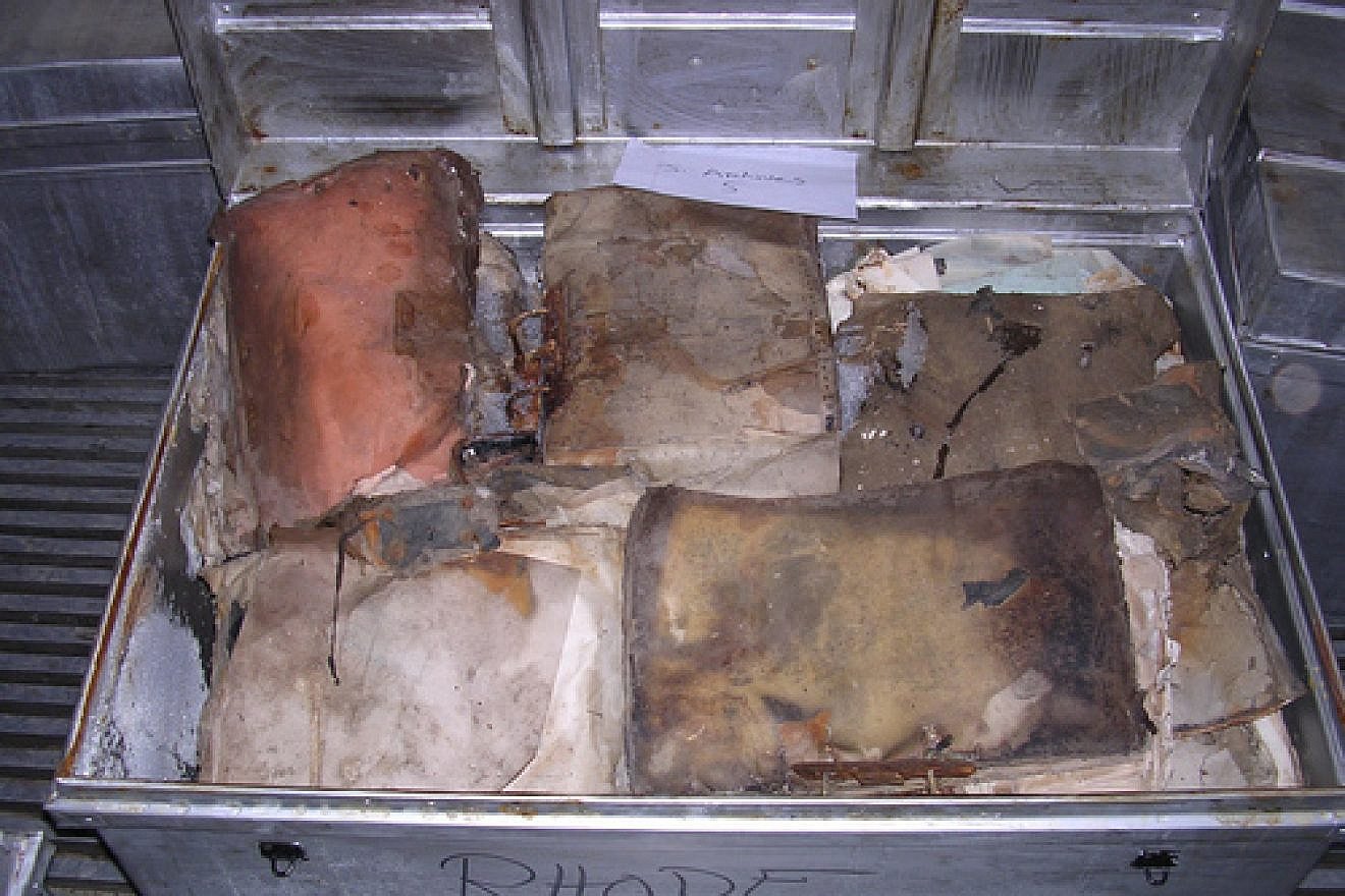 Click photo to download. Caption: Pictured before restoration, Iraqi Jewish Archive items that were recovered in by the U.S. in 2003 from the flooded basement of the Mukhabarat, Saddam Hussein’s intelligence headquarters. Credit: National Archives and Records Administration.