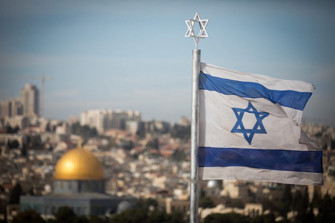 An Israeli flag waves in front of the Temple Mount, Dec. 5, 2017. Photo by Yonatan Sindel/Flash90.