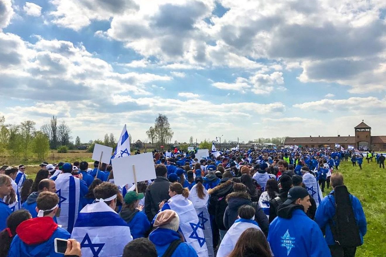 Thousands of young people from around the world walk from Auschwitz to Birkenau, the sites of former Nazi death camps, as part of the 2017 “March of the Living” program in Poland. Credit: Drew Jacobson via Facebook.