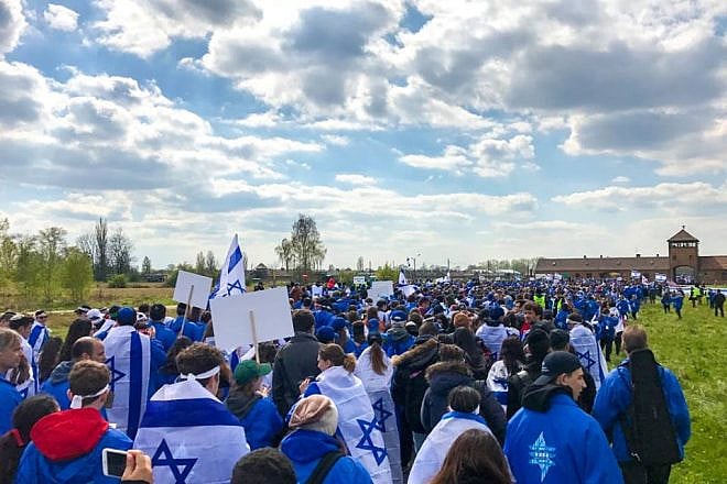 Thousands of young people from around the world walk from Auschwitz to Birkenau, the sites of former Nazi death camps, as part of the 2017 “March of the Living” program in Poland. Credit: Drew Jacobson via Facebook.