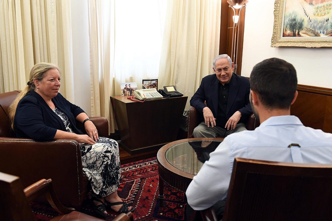 Prime Minister Benjamin Netanyahu meets in Jerusalem with Ziv Moyal (right), the Israeli embassy security guard who was attacked before shooting his assailant and two bystanders in Amman, and then-Ambassador to Jordan Einat Schlein, July 25, 2017. Photo by Haim Zach/GPO.