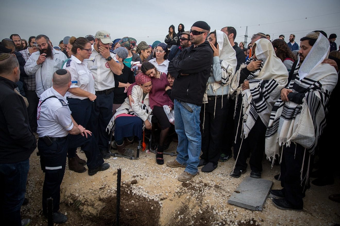 Friends and family attend the funeral of terror victim Rabbi Raziel Shevah, 35, in the Samaria settlement outpost of Havat Gilad on Jan. 10, 2018. Credit: Miriam Alster/Flash90.