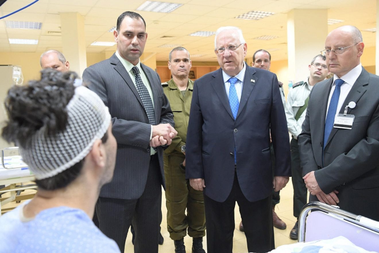 Israeli president Reuven Rivlin visits Syrians wounded in the civil war in Syria being treated at a hospital in the northern Israeli city of Nahariya. April 9, 2017. Photo by Amos Ben Gershom/GPO.