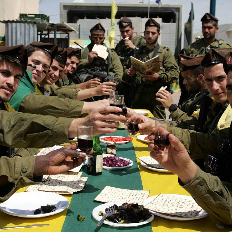 Israeli soldiers of the Golani Brigade eat a Passover meal. Credit: Edi Israel/Flash90.