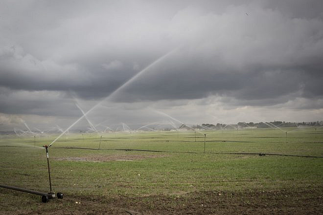 Sprinklers water the plantation fields near the southern Israeli city of Sderot, on Jan. 21, 2017. Photo by Nati Shohat/Flash90.