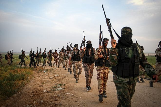 Palestinian Islamic Jihad members march during a military drill near the border with Israel, east of the town of Khan Younis in the southern Gaza Strip, on March 27, 2018. Photo by Abed Rahim Khatib/Flash90.