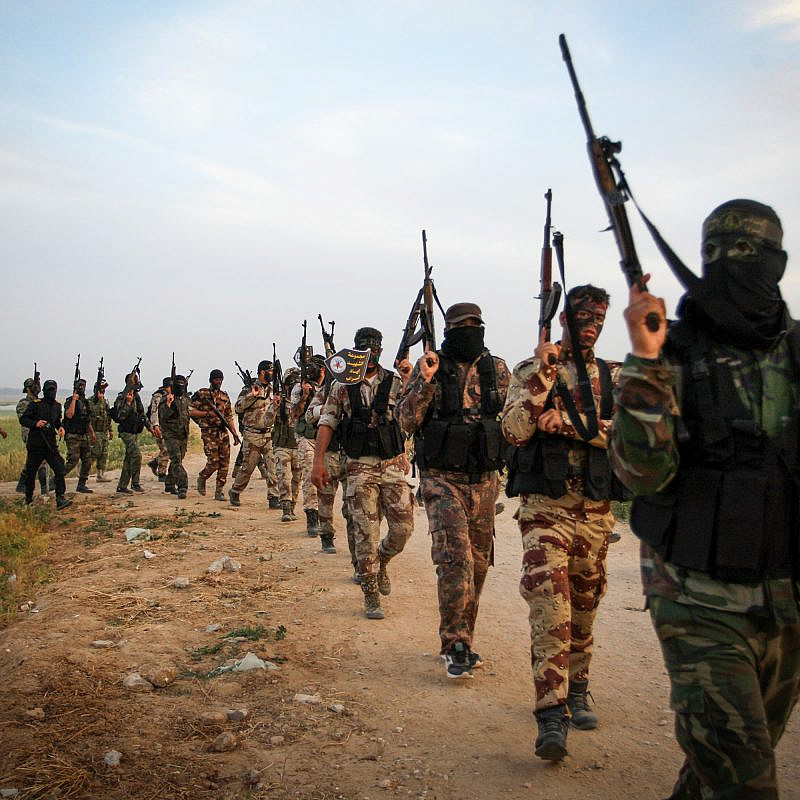 Palestinian Islamic Jihad members march during a military drill near the border with Israel, east of the town of Khan Younis in the southern Gaza Strip, on March 27, 2018. Photo by Abed Rahim Khatib/Flash90.