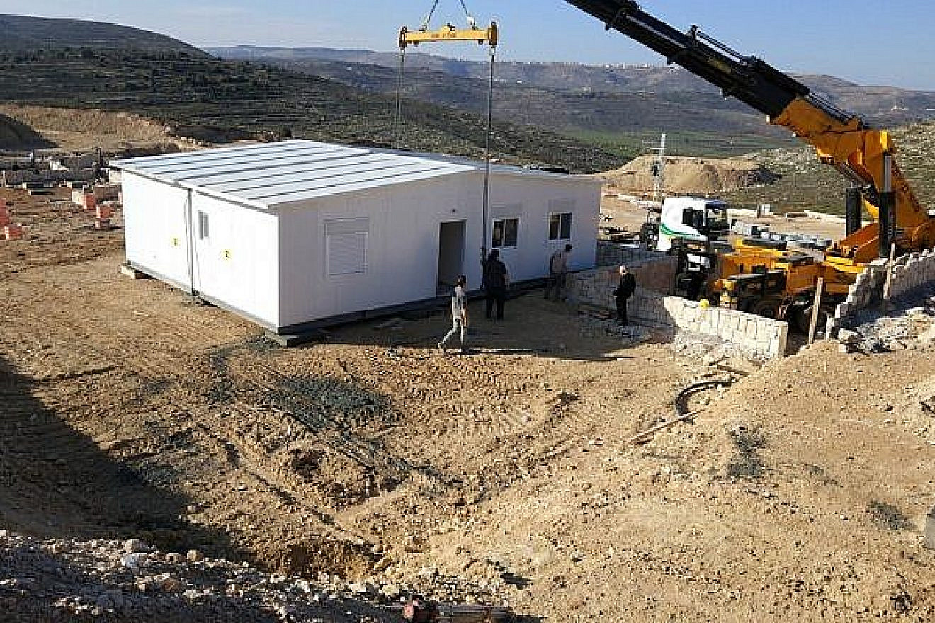 First caravilla is erected on the grounds of the new Amichai settlement for evacuees of Amona on Feb. 21, 2018. Credit: Amona evacuees.