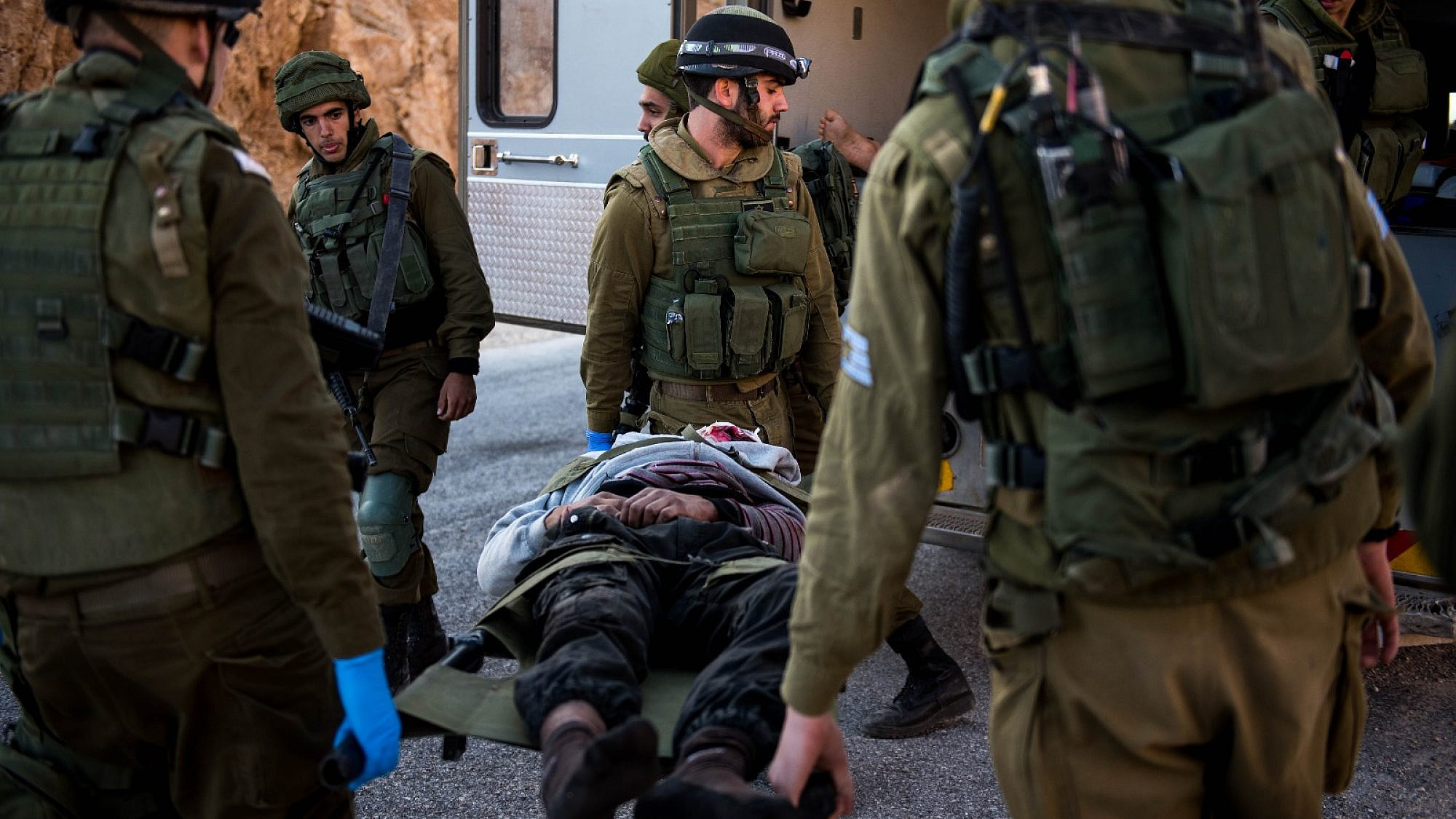 IDF troops transport an injured Syrian civilian as part of “Operation Good Neighbor.” Credit: IDF website.