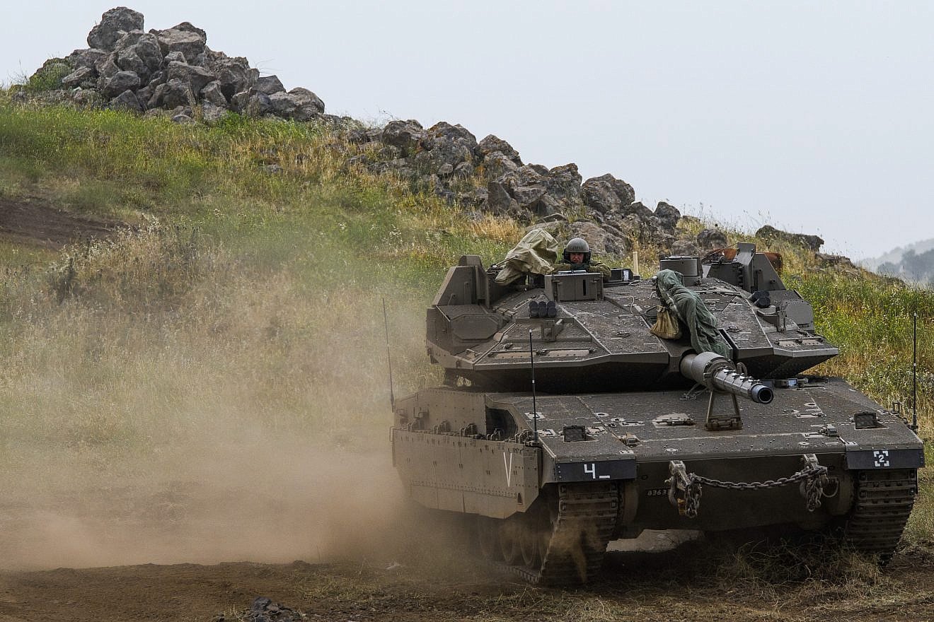 Israeli soldiers seen near the Israeli-Syrian border in the Golan Heights on May 7, 2018. Credit: Basel Awidat/Flash90.