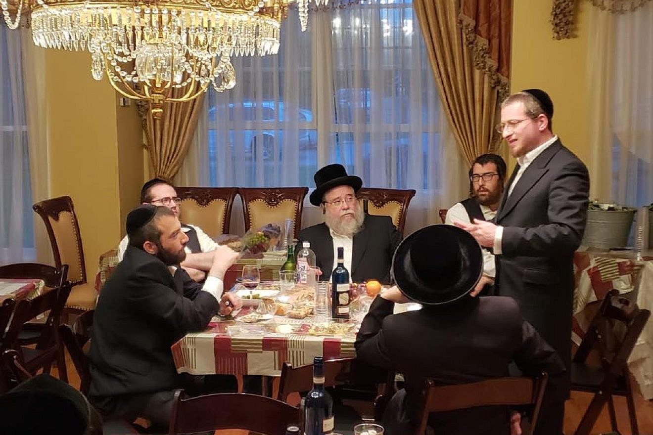Rabbi Menachem Bombach (standing) explained his school’s network to fellow members of the haredi community. Credit: Courtesy.