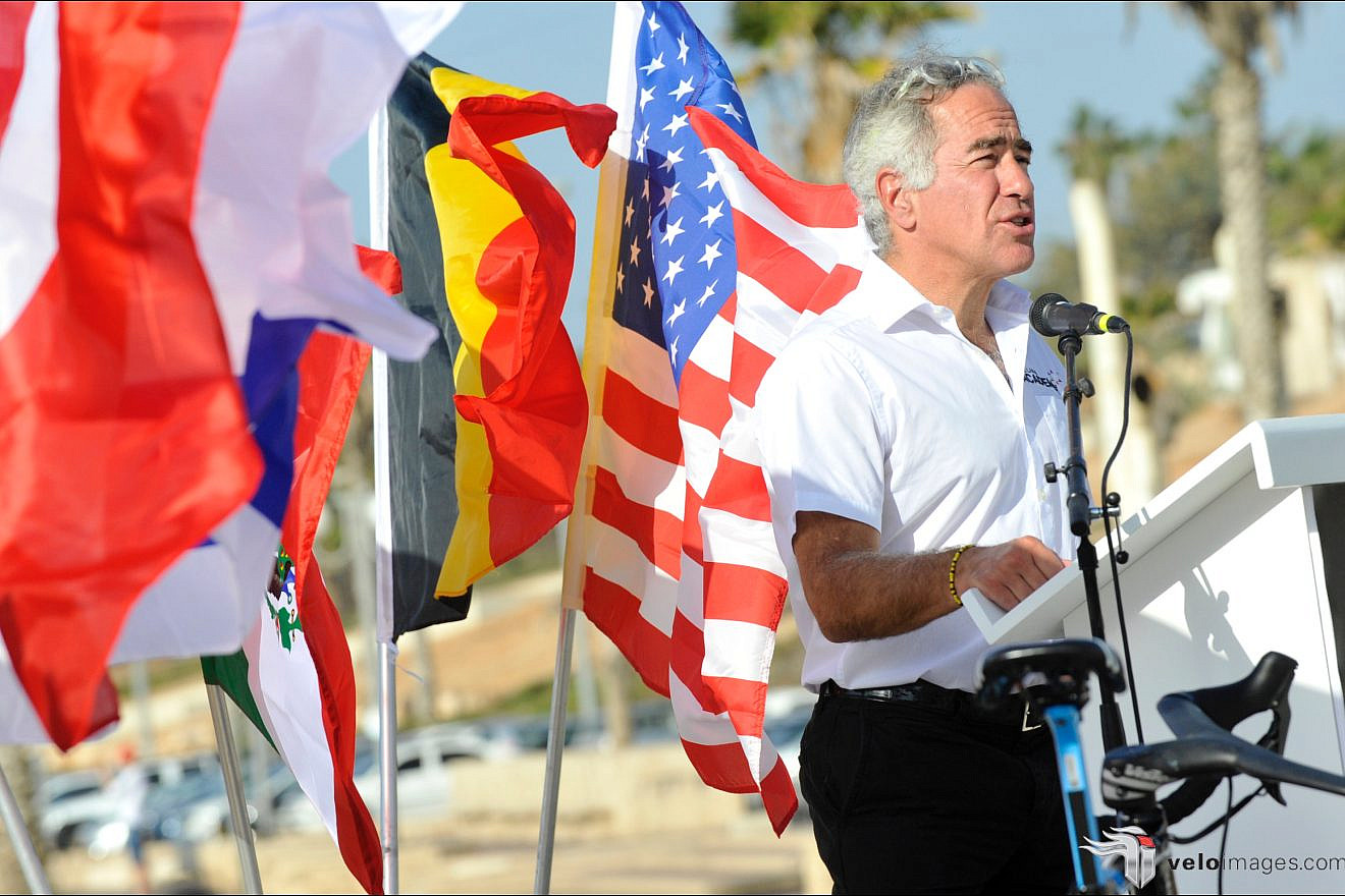 Canadian Jewish-Israeli philanthropist Sylvan Adams speaks at a cycling event in Israel. Credit: Israel Cycling Academy.