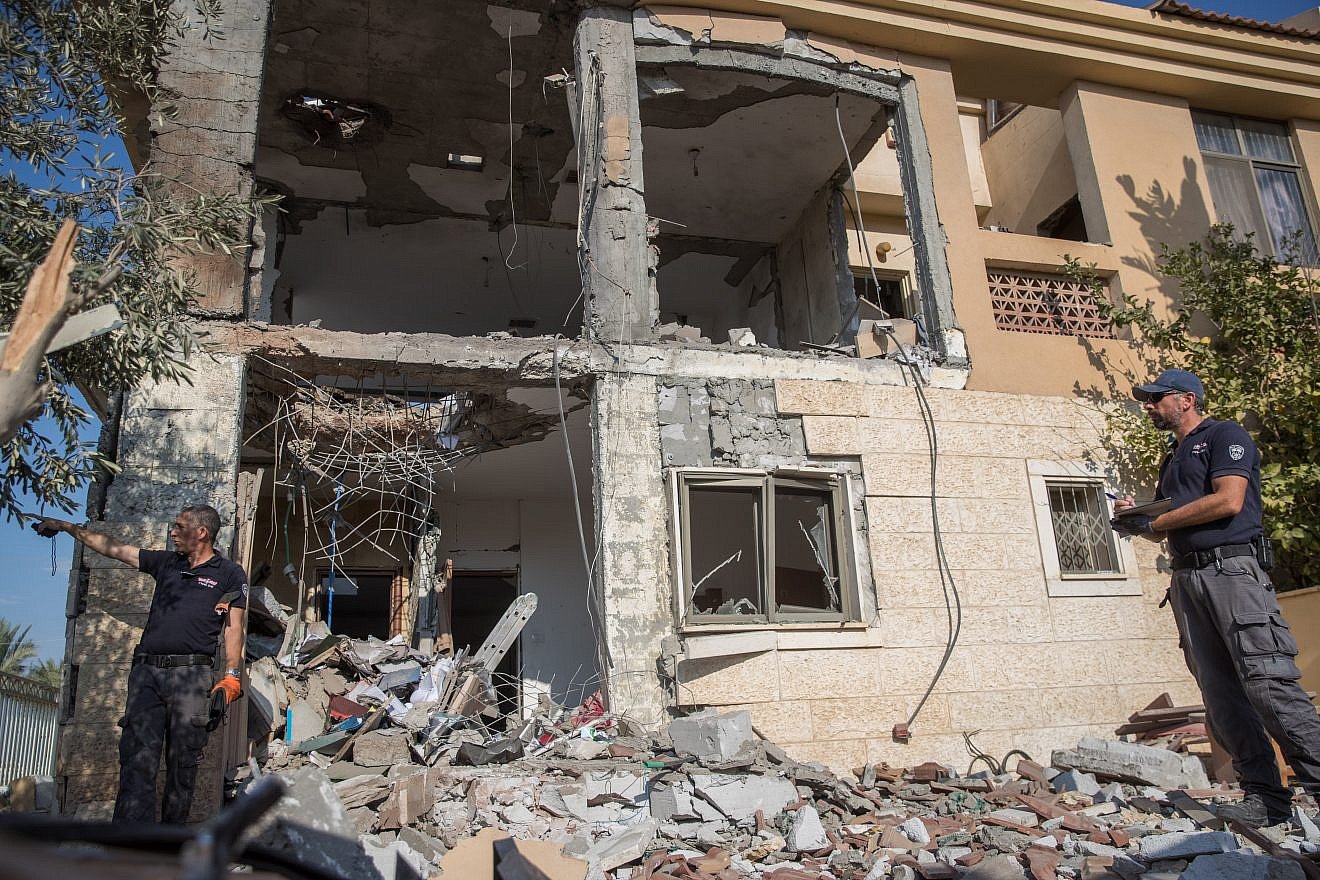 Israeli security forces at the scene where a building was hit by a rocket fired from the Gaza Strip in the southern Israeli city of Beersheva on Oct. 17, 2018. Photo by Yonatan Sindel/Flash90.