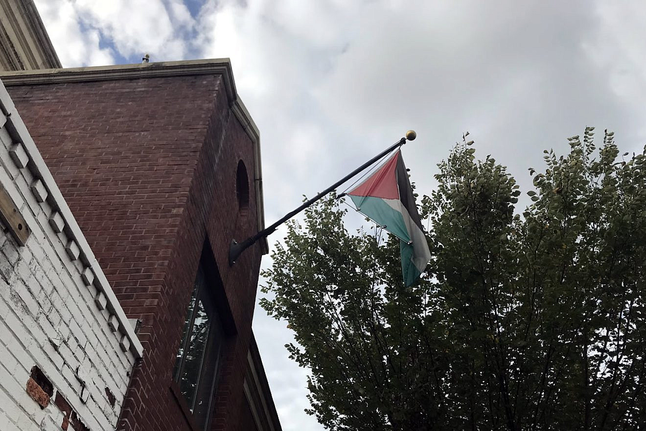 The Palestinian flag just moments before being taken down from the PLO Mission in Washington on Oct. 10, 2018. The Trump administration last month ordered the office to be closed. Credit: Jackson Richman/JNS.
