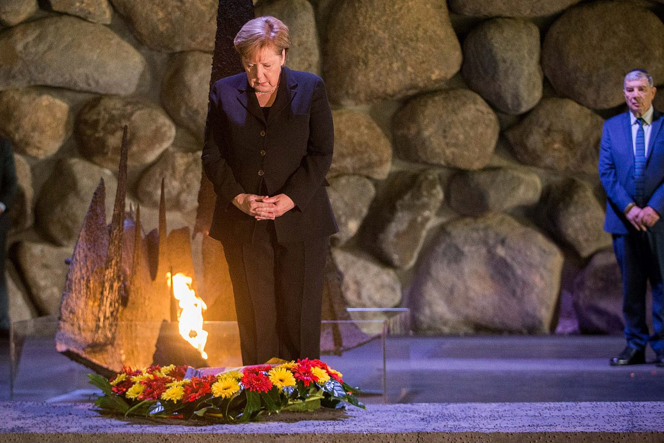 German Chancellor Angela Merkel lays a wreath during a ceremony at the Hall of Remembrance in the Yad Vashem Holocaust memorial in Jerusalem on Oct. 4, 2018. Photo by Oren Ben Hakoon/POOL.