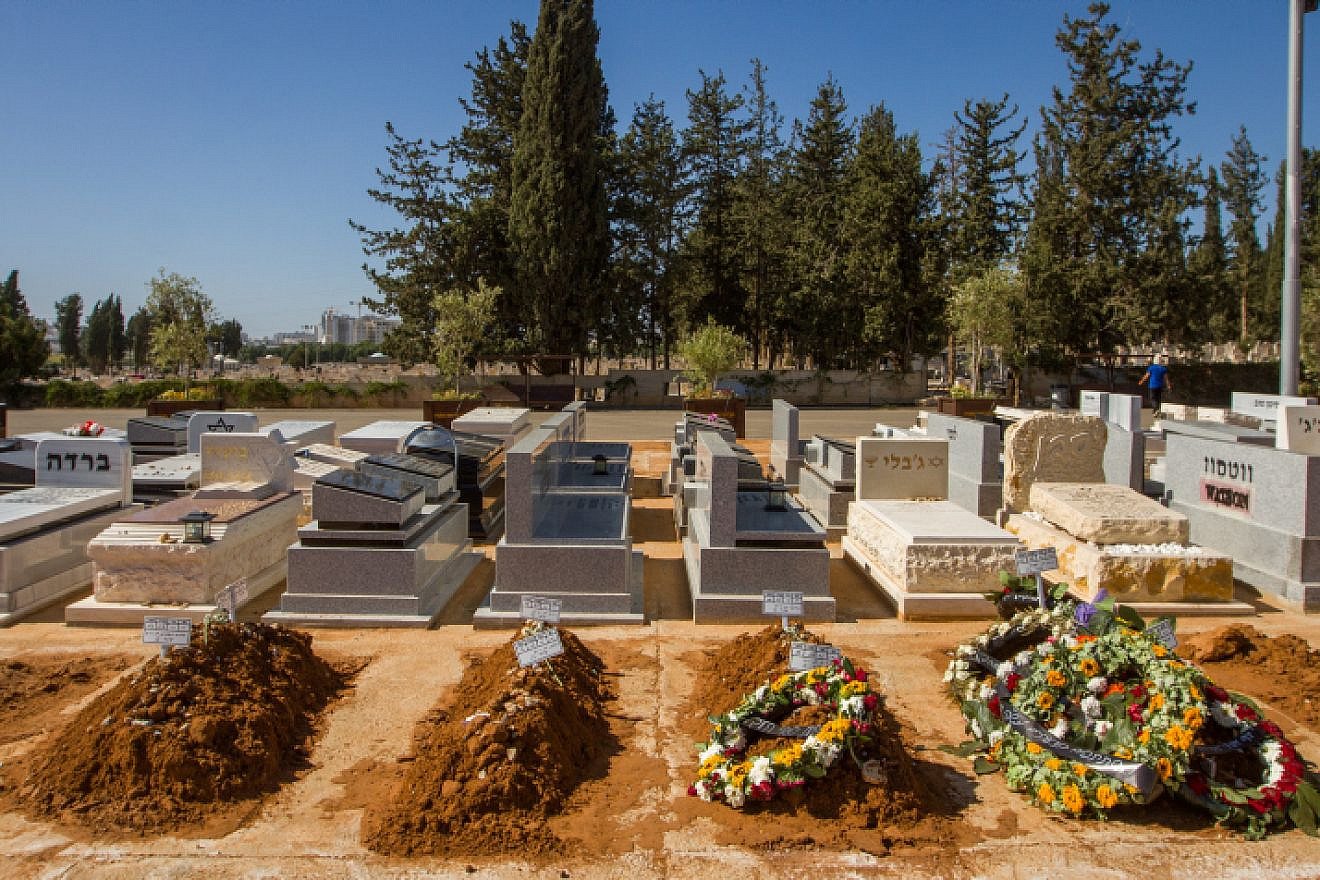 The fresh graves of eight members of the Atar family in a Netanya cemetery on Nov. 1, 2018. The entire family was killed on route 90 after another car hit theirs. Photo by Flash90.