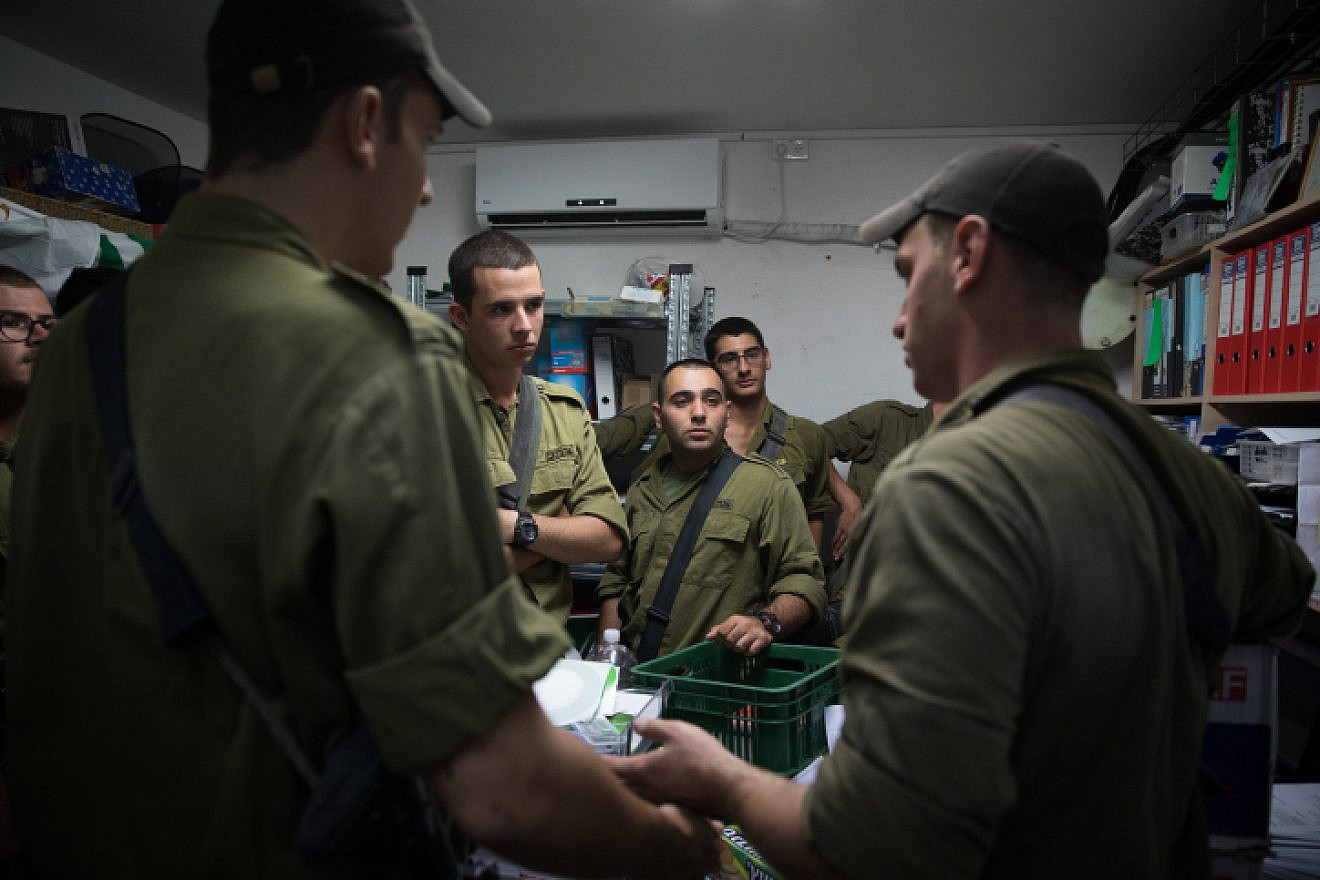 Israeli soldiers stand inside a street-level bomb shelter as a siren warns of incoming rockets fired from Gaza into Israel on Nov. 12, 2018. Photo by Hadas Parush/Flash90.