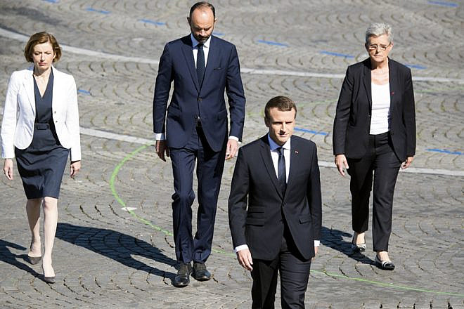 French President Emmanuel Macron heads to the reviewing stand for the annual Bastille Day military parade in Paris on July 14, 2017. Credit: Department of Defense Photo by Navy Petty Officer 2nd Class Dominique Pineiro.