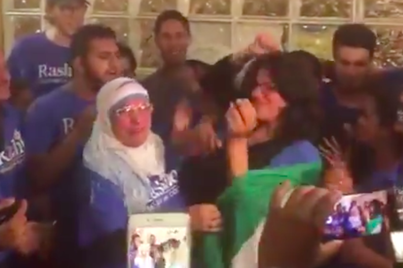 Democratic congresswoman-elect Rashida Tlaib is wrapped in a Palestinian flag by her mother at a celebratory party after winning the race in Michigan's 13th congressional district on Nov. 8, 2018. Credit: Screenshot.