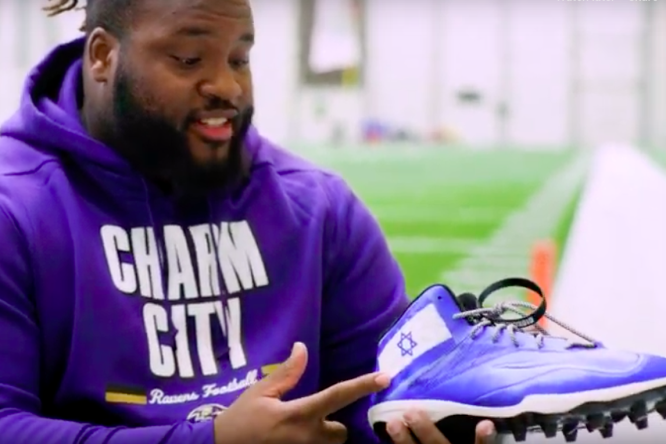 Baltimore Ravens defensive tackle Michael Pierce shows his customized cleats, partnering with the Israel Collective as part of the National Football League’s “My Cause, My Cleats” campaign. Credit: Screenshot.
