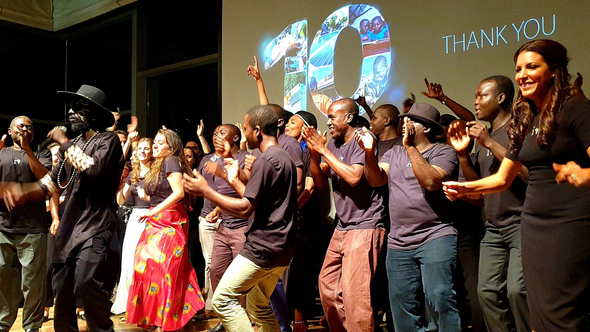 Innovation: Africa founder Sivan Yaari dances on stage with her organization's employees and volunteers at the Peres Center for Peace and Innovation. Credit: Courtesy.
