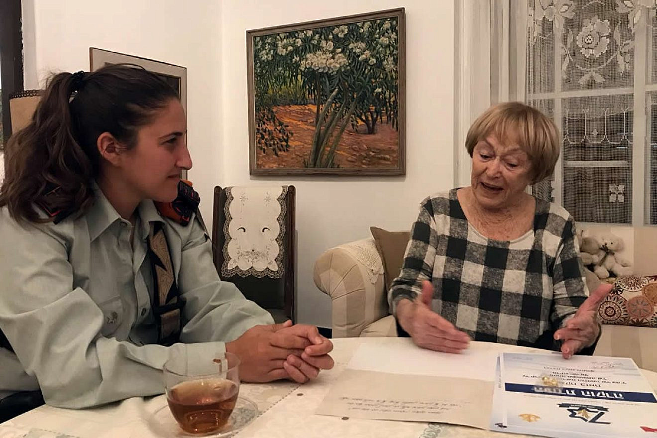 Capt. Ayelet Zion, a 25-year-old Israel Defense Force Company Commander in the Home Front Command Search and Rescue Battalion, with Leah Feldman, who served as a signals operator in the 1948 War of Independence. Credit: IDF.