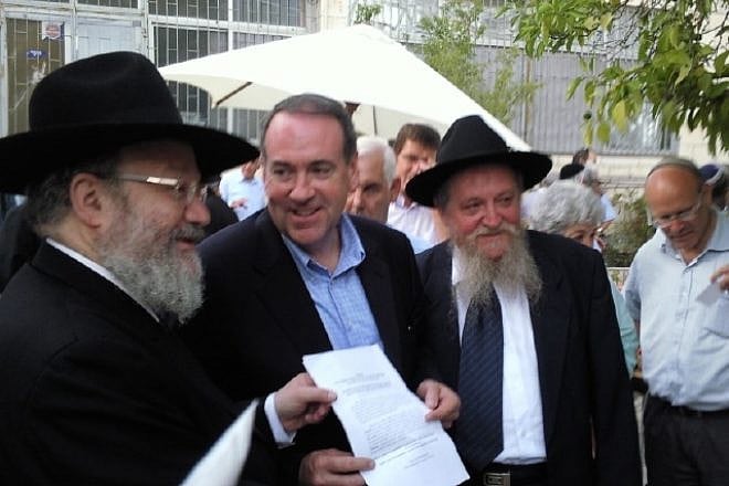 Former Arkansas Gov. Mike Huckabee with Rabbinical Council for Peace leaders Rabbis Joseph Gerlitzky and Avraham S. Lewin. Credit: RCP.
