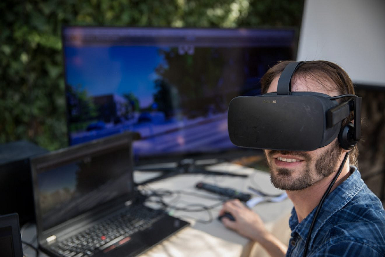 A man uses Virtual Reality glasses as start-up groups showcase their products at the Innovation Lab event at the Tower of David Museum in Jerusalem's Old City, on Oct. 17, 2017. Photo by Hadas Parush/Flash90.