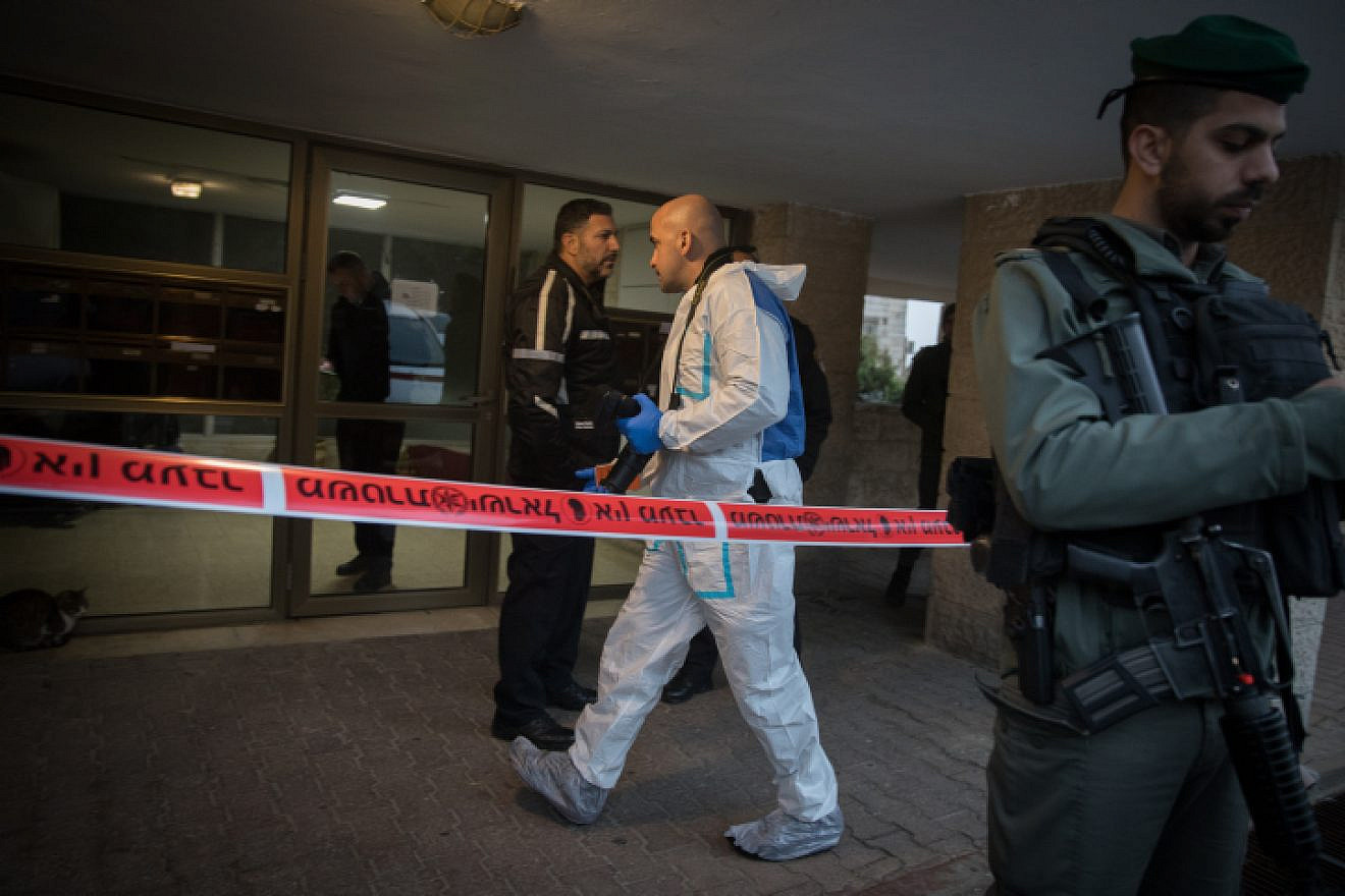 Israeli forces seen outside the building where two people was found dead at an apartment in the at Armon Hanatziv neighborhood in Jerusalem, on Jan. 13, 2019. Photo by Noam Revkin Fenton/Flash90.