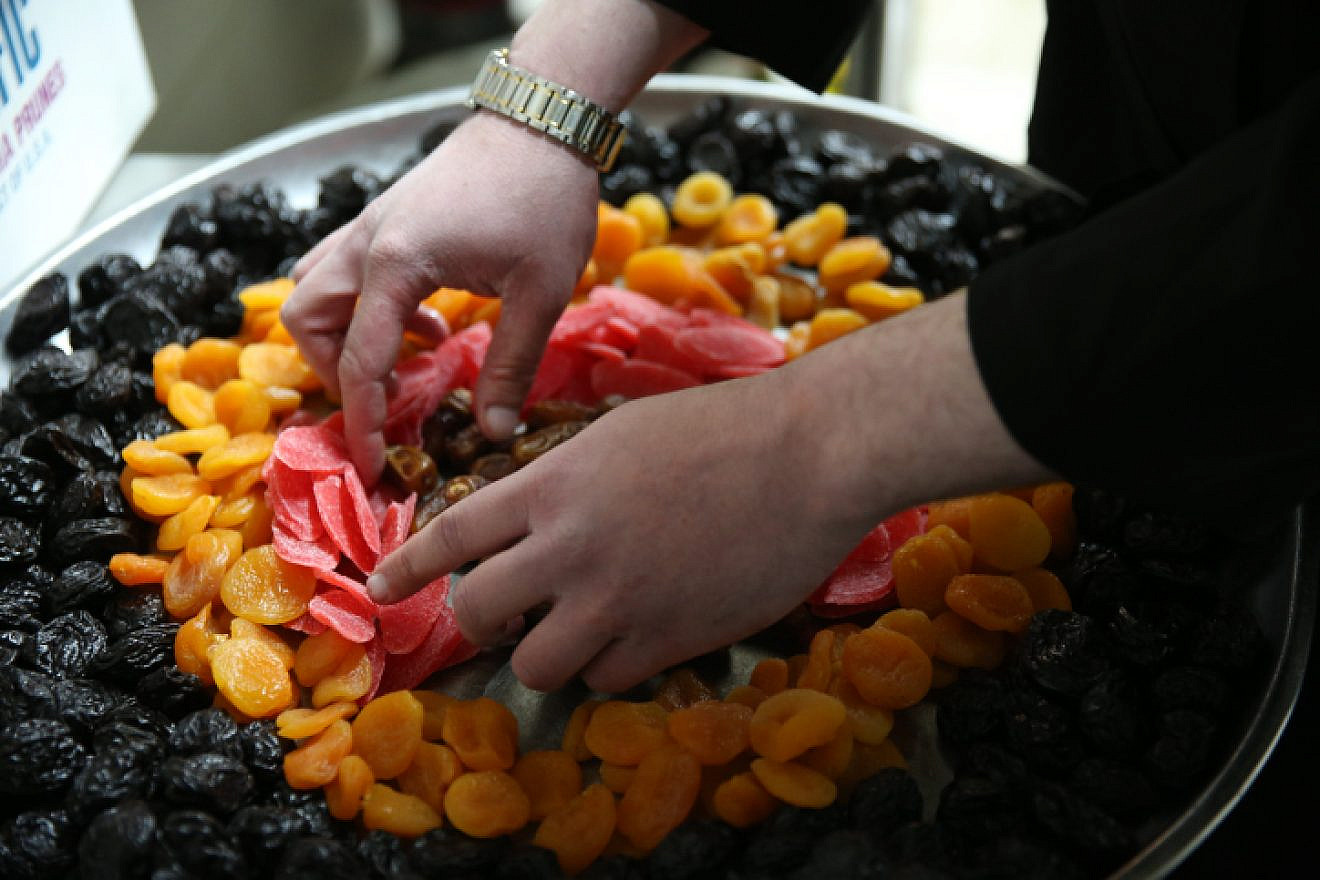 Dried fruits are prepared for a Tu B’Shevat holiday celebration in Meron, in northern Israel on Jan. 20, 2019. Photo by David Cohen/Flash90.
