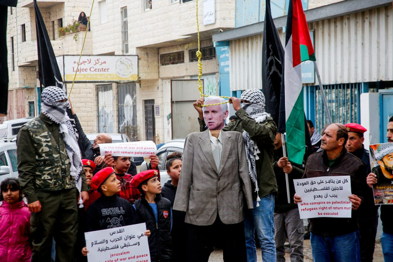 Palestinians hang dolls bearing the portrait of U.S. Vice President Mike Pence and U.S. President Donald Trump during a protest in the West Bank city of Bethlehem on Jan. 27, 2018. Photo by Wisam Hashlamoun/Flash90.