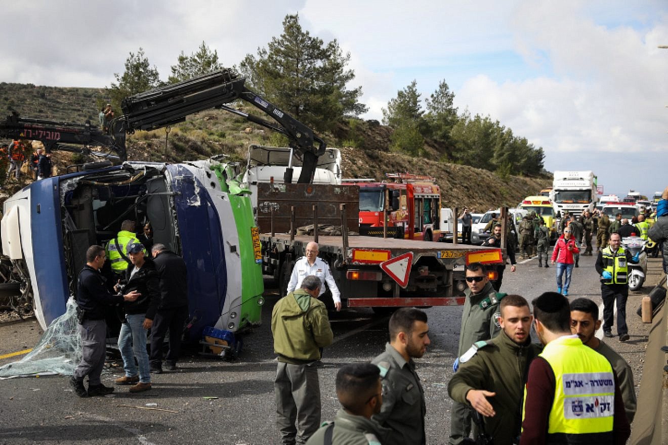 Israeli rescue forces and security forces at the scene of a car accident between a bus and a minivan on Road 433 near Modi’in on Feb. 10, 2019. Photo by Noam Revkin Fenton/Flash90.