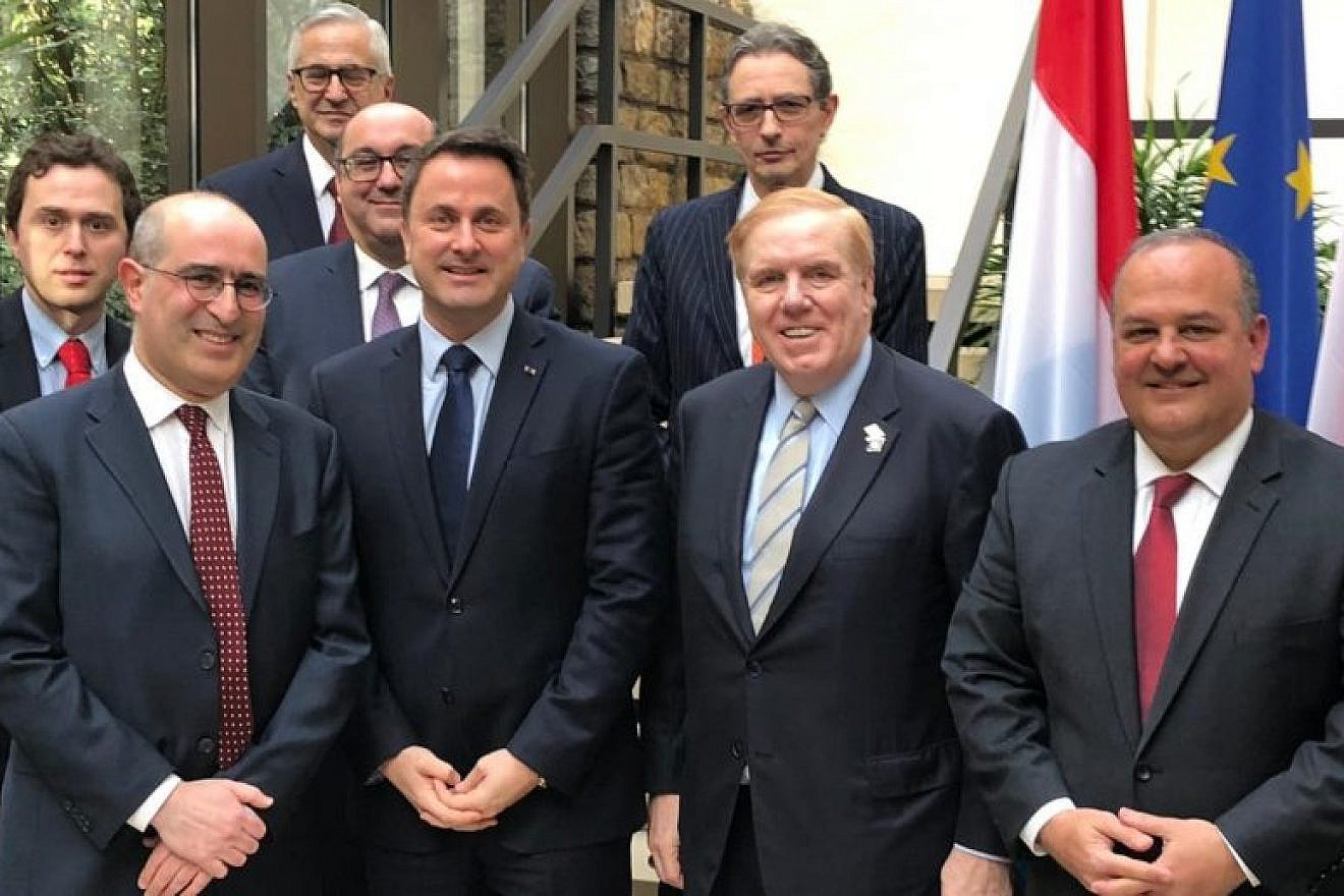 Front row (from left): Gideon Taylor, chair of operations, WJRO; Xavier Bettel, Prime Minister of Luxembourg; Randy Evans, U.S. Ambassador to Luxembourg; and Tom Yazdgerdi, U.S. Special Envoy for Holocaust Issues. Second row (front): Evan Hochberg, director of international affairs, WJRO; Albert Aflalo, president, Consistoire Israélite Luxembourg; Franҫois Moyse, president, Foundation Luxembourgeoise de la Mémoire Shoah. Back row (from left): Wesley Fisher, director of research, WJRO. Credit: WJRO.