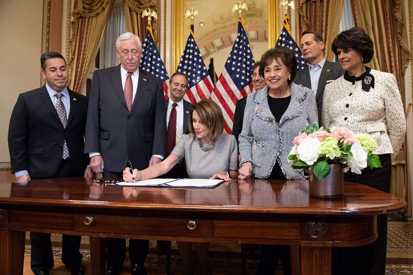 Speaker of the House Nancy Pelosi signs a bill along with Democratic House leadership on Jan. 25, 2019. Credit: Nancy Pelosi via Twitter.