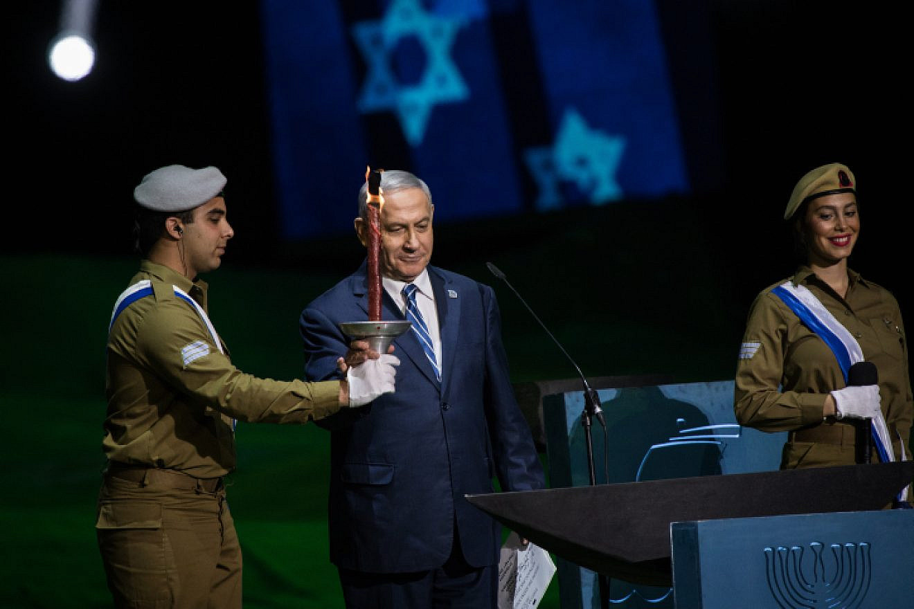 Israeli Prime Minister Benjamin Netanyahu lights a torch at the 70th anniversary Independence Day ceremony on Mount Herzl in Jerusalem, on April 18, 2018. Photo by Hadas Parush/Flash90.