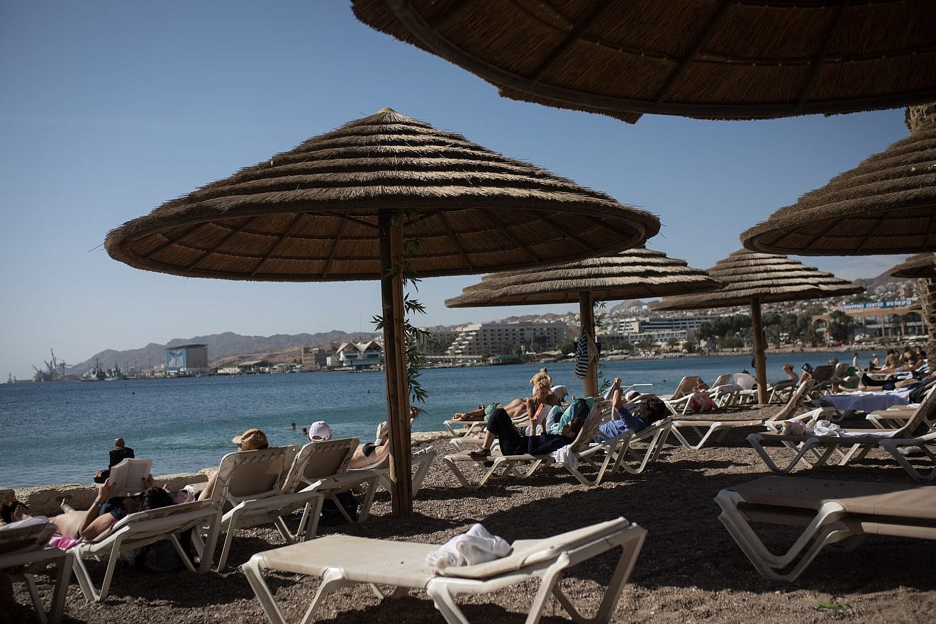 Visitors and tourists at the beach in the southern Israeli city of Eilat, on Jan. 5, 2019. Credit: Hadas Parush/Flash90.