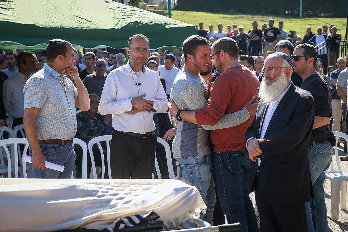 Family and friends attend the funeral of Rabbi Achiad Ettinger, who died after being shot in a terror attack near Ariel on March 17, in the Jewish settlement of Eli, March 18, 2019. Credit: Noam Revkin Fenton/Flash90.