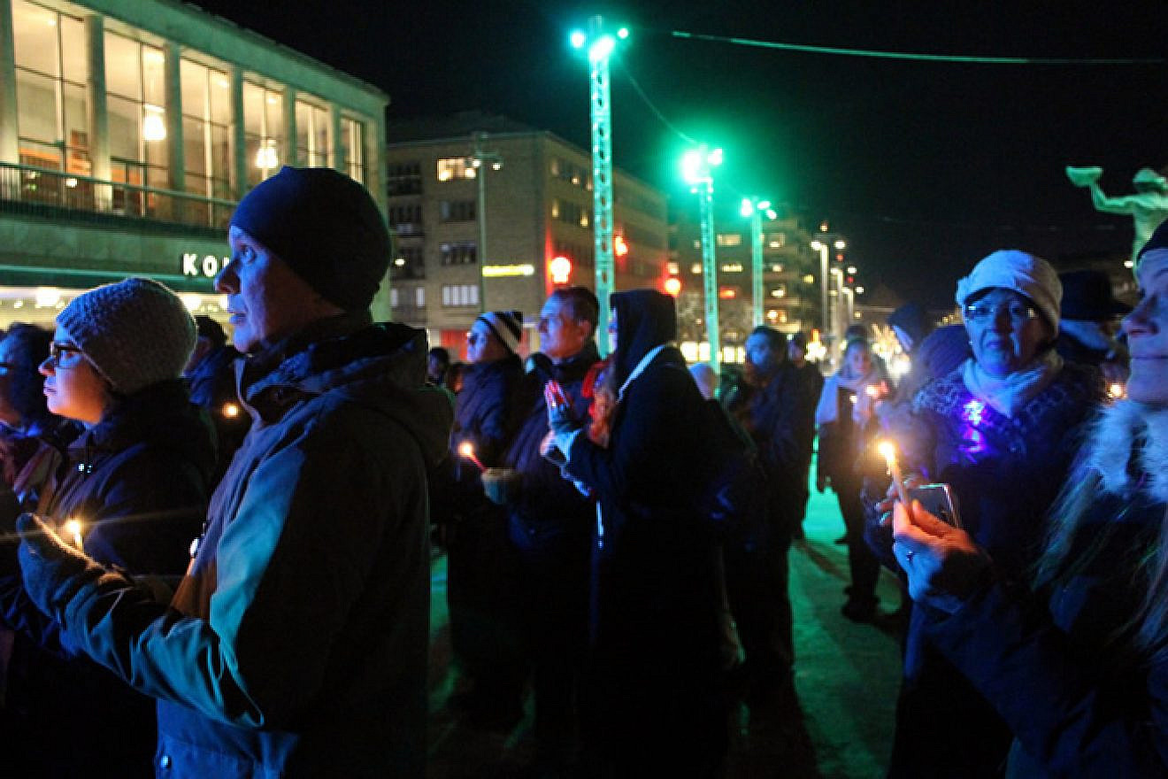 Hundreds of people, Jews and non-Jews alike, gathered in Gothenburg, Sweden, just days after a local synagogue was firebombed to light the menorah on Dec. 12, 2017, the first night of the eight-day holiday of Hanukkah. Credit: Chabad.org/News.