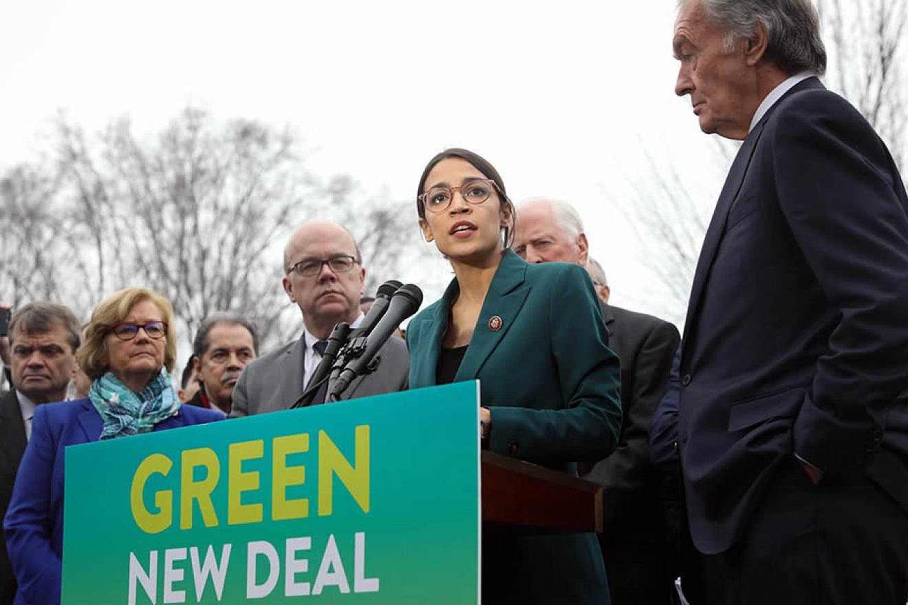 Rep. Alexandria Ocasio-Cortez (D-N.Y.) speaks on the Green New Deal with Sen. Ed Markey (D-Mass.) to her right in front of the Capitol Building in Washington, D.C., on Feb. 7 2019. Credit: Wikimedia Commons.