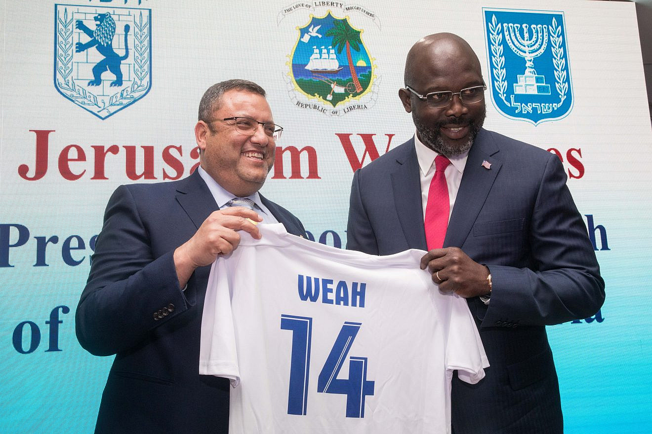 Mayor of Jerusalem Moshe Leon with Liberian President George Weah during a soccer event in Jerusalem on Feb. 27, 2019. Photo by Noam Revkin Fenton/Flash90.