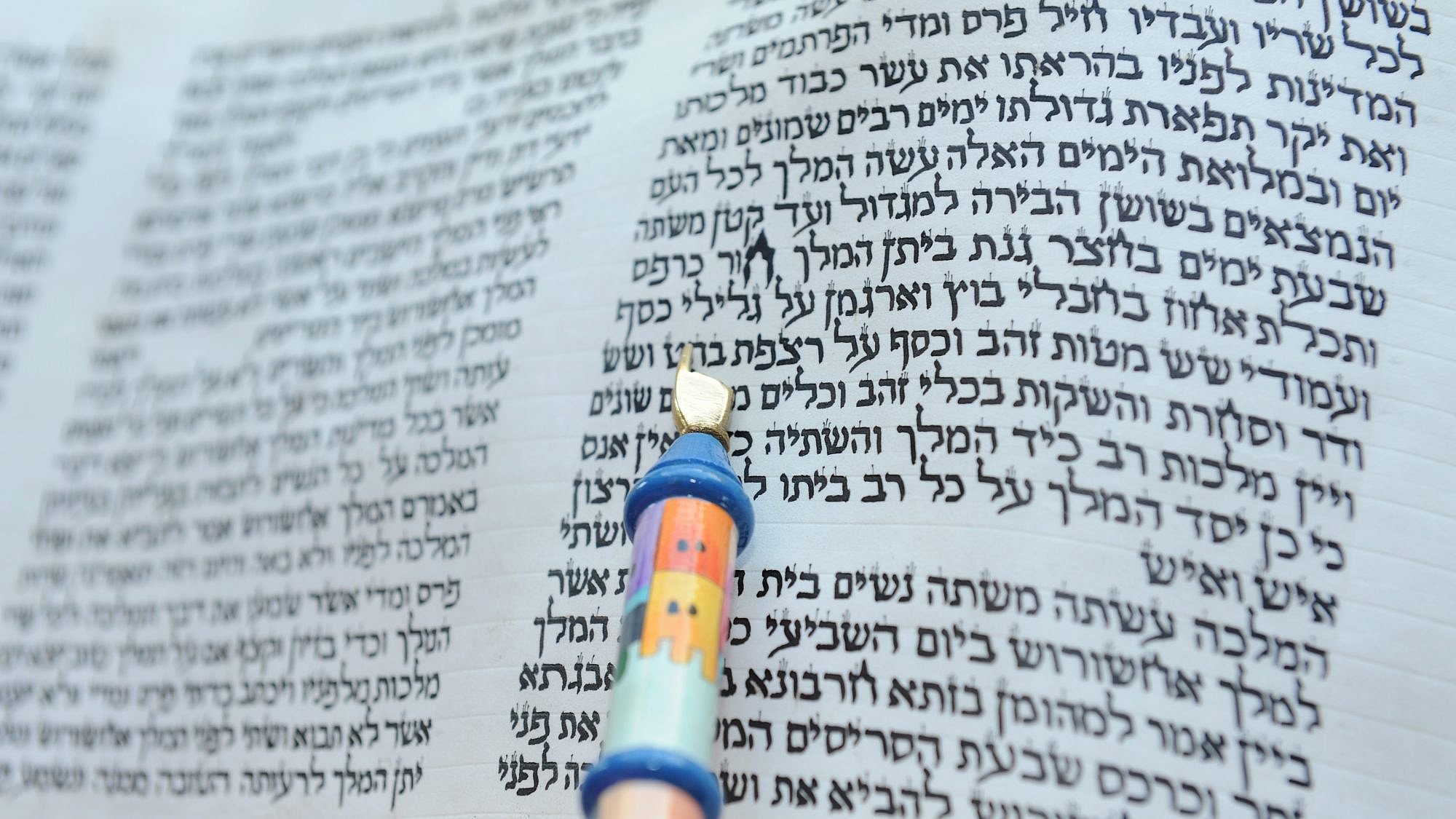 First chapter of a hand-written scroll of the Book of Esther, with reader's pointer, March 11, 2009. Credit: Chefallen via Wikimedia Commons.