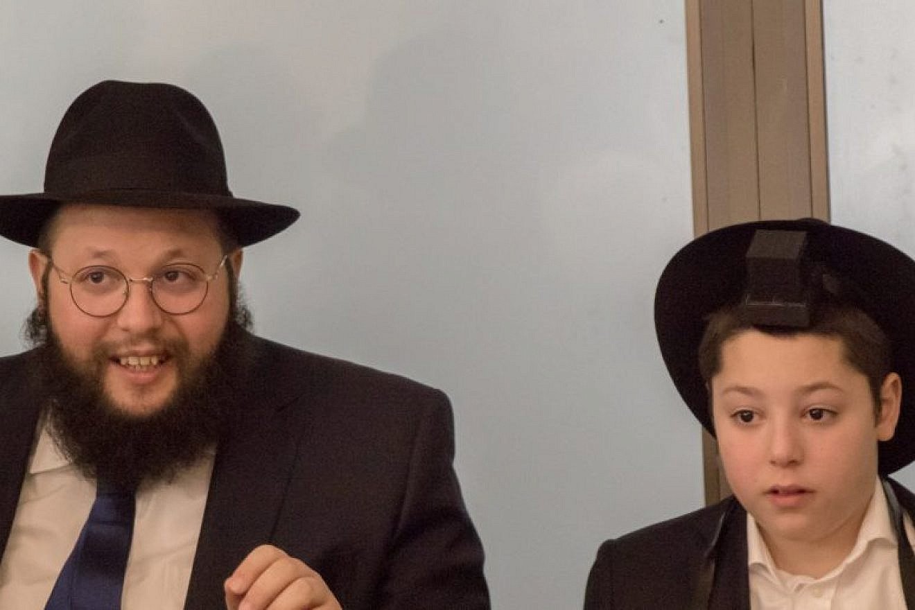 Rabbi Shalom Ber Stambler, chief rabbi of Chabad in Poland (pictured with his son Yossi), will host a special Passover seder with the families of ghetto survivors from Israel, Europe and the U.S. Picture by Muzeum Getta Warszawskiego. (EJP)