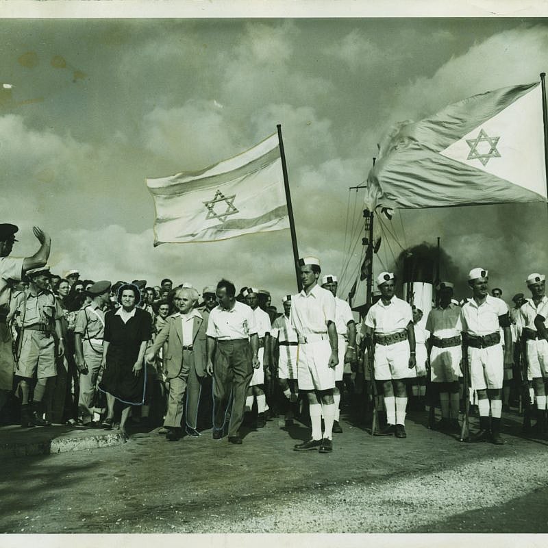 Arab troops at the port in Haifa surrendering to the Israel Defense Forces and Palyam (naval corps) soldiers, who were waving the Israeli and Navy flags at the port for the very first time. Credit: Kedem Auction House.