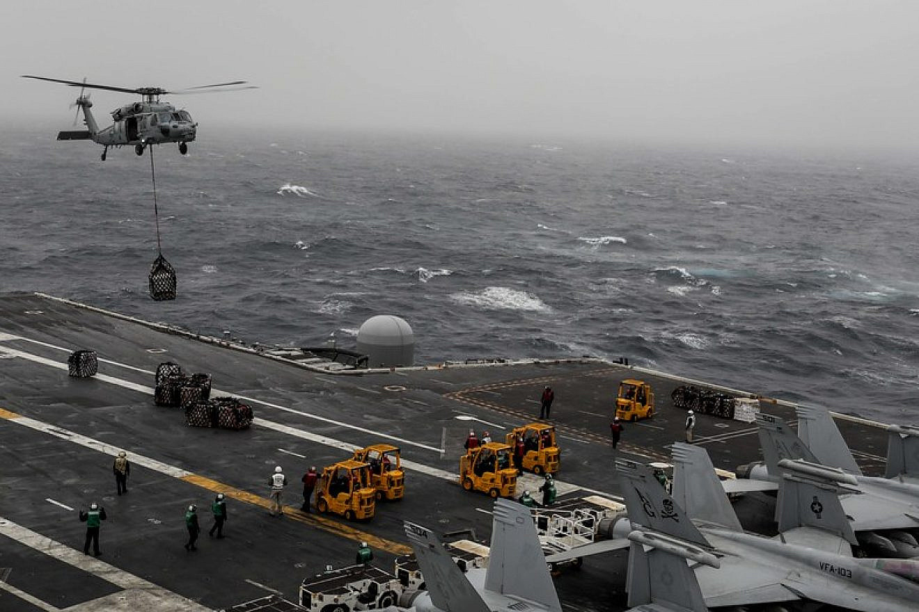 The “USS Abraham Lincoln” takes on supplies. Credit: Garrett LaBarge/U.S. Navy.