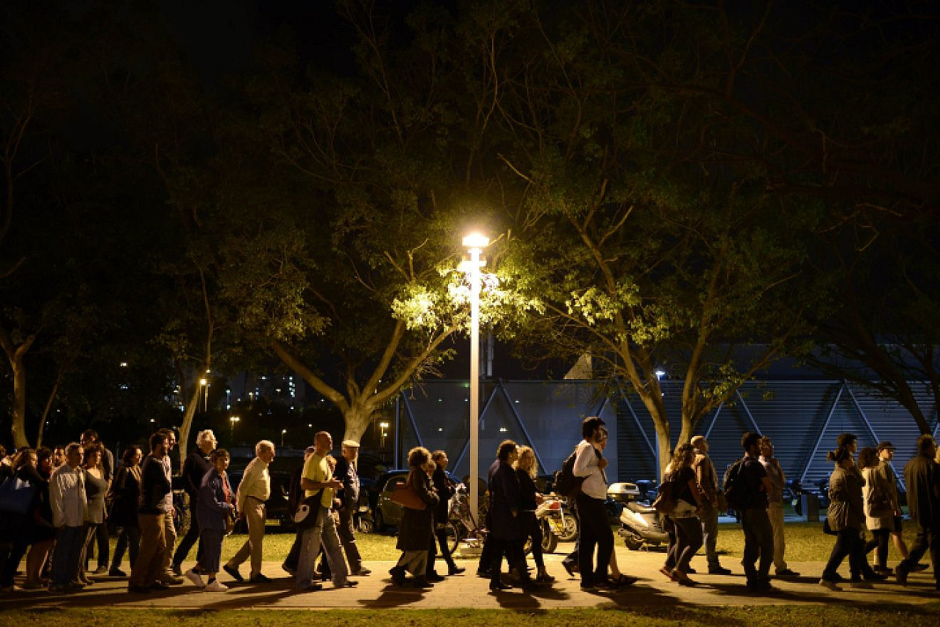 Palestinians and Israelis attend what has become a controversial ceremony for the families of Israeli and Palestinian victims as part of a joint memorial day event in Tel Aviv in 2015. Photo by Tomer Neuberg/Flash90.